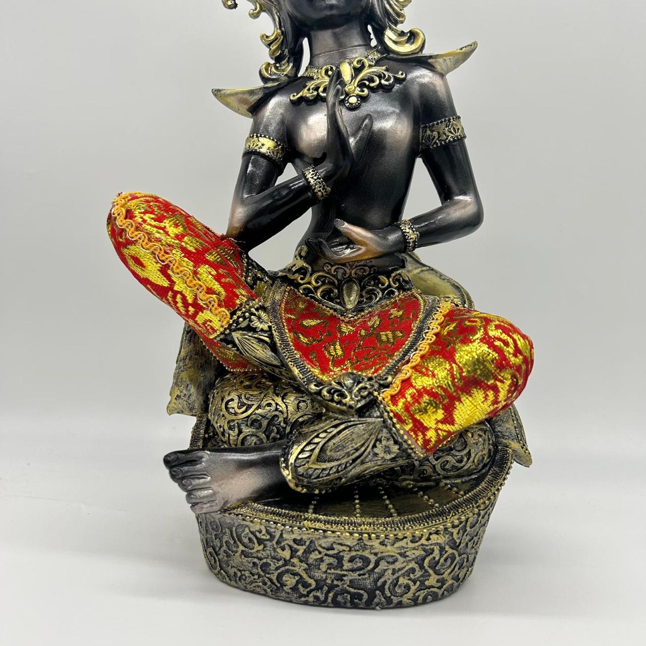 Thai Buddha Statue Sitting on Pedestal