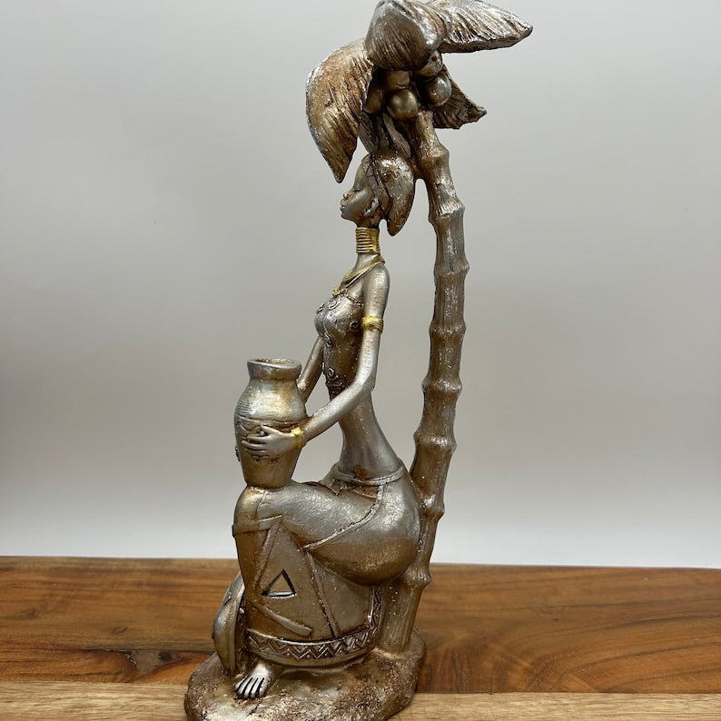 12" African Women Holding Pot Sitting under Coconut Tree Figurine