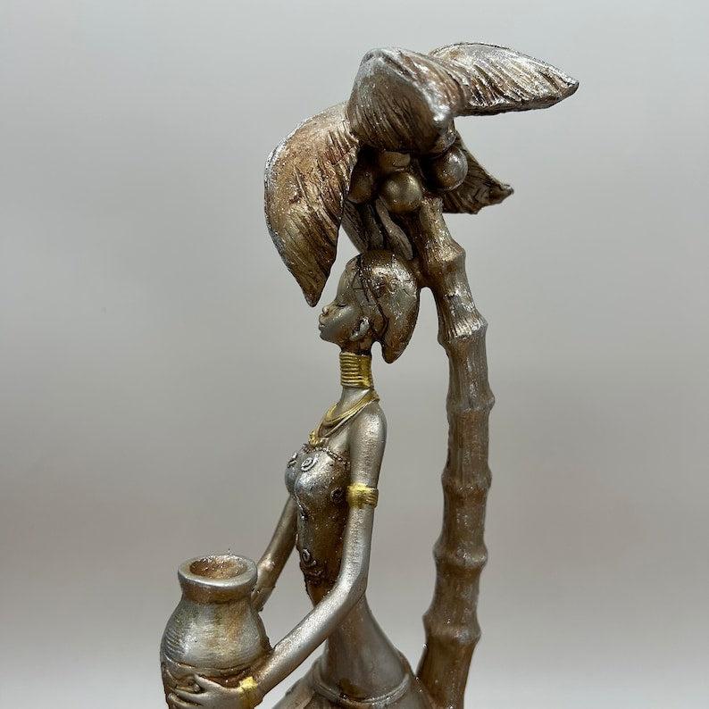12" African Women Holding Pot Sitting under Coconut Tree Figurine