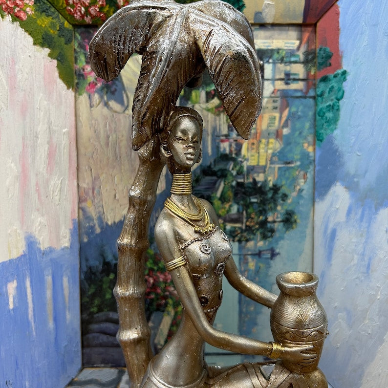 12" African Women Holding Pot Sitting under Coconut Tree Figurine